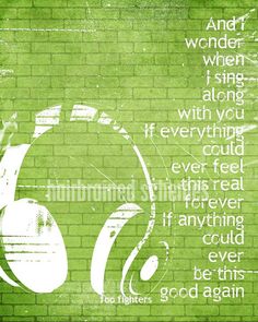 a green brick wall with headphones on it and the words, i am not wonder when