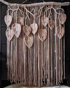 macrame hangings with heart shaped leaves on them