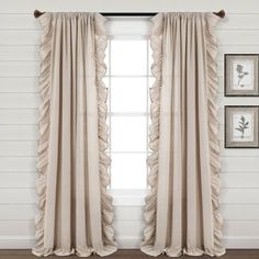 the curtains in this room have ruffles on them and are ready to be hung