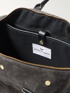 Based on the traditional duffle bag, Bennett Winch's 'Commuter' holdall is perfect for busy days or an overnight stay. It's made from premium suede, trimmed with leather and kitted out with several pockets and spaces. The detachable waterproof compartment is ideal for stowing gym gear. This product was Locally Made and made to Last Longer. Find out more about our Craftsmanship Code here. Luxury Briefcase With Waxed Finish, Suede Travel Bag With Leather Trim, Leather Travel Bag With Suede Lining, Travel Suede Bag With Leather Trim, Modern Suede Satchel For Travel, Designer Suede Shoulder Bag For Travel, Luxury Travel Bags With Suede Lining, Travel Suede Satchel With Leather Handles, Suede Satchel With Leather Handles For Travel