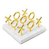 six gold - plated crosses and an xo symbol on a white marble stand