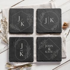 four personalized slate coasters with the names and initials