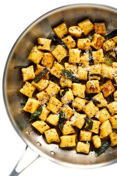 tofu and spinach in a pan with seasoning