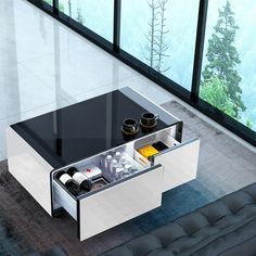 a modern coffee table with two drawers on each side and bottles in the bottom drawer