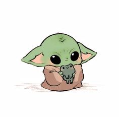 the baby yoda is holding a small animal