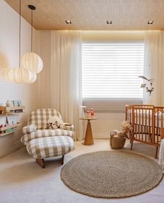 a baby's room is decorated in neutrals and whites, including checkered furniture