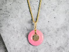 The 'Lantau Zhong Pink Jade Fu Fuku Fortune Pendant' is one of our classic designs. Bold, and charming, the pink jadeite creates an aura of playfulness and joy. (Chain not included) Stock ID: 9LZPJFFFP14Y Materials: 0.35g 14K Yellow Gold, 1.55g Pink Jade Dimensions: 22 x 16 x 3.5 Gross Weight: 1.90g Pink Jade Jewelry Gift, Pink Jade Jewelry As A Gift, Pink Jade Jewelry For Gift, Elegant Pink Jade Jewelry, Luxury Handmade Pink Necklace, Luxury Pink Round Pendant Jewelry, Luxury Pink Round Pendant Necklaces, Luxury Pink Round Pendant Necklace, Marinette Aesthetic