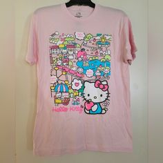 Pink Hello Kitty T-Shirt New, Never Used! Casual Pink Hello Kitty T-shirt, Pink Cotton Hello Kitty T-shirt, Trendy Pink Hello Kitty T-shirt, Pink Hello Kitty T-shirt For Spring, Hello Kitty Kawaii T-shirt For Spring, Kawaii Hello Kitty T-shirt For Spring, Pink Hello Kitty Short Sleeve T-shirt, Pink Hello Kitty Crew Neck T-shirt, Spring Kawaii Hello Kitty T-shirt