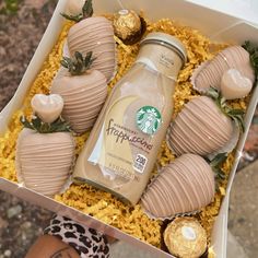 a starbucks drink and chocolate covered strawberries in a box