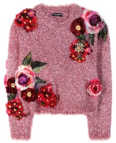 a pink sweater with flowers on it