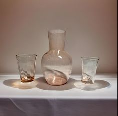 💧Cute Bedside Water Carafe Set -- Authentic Pink Depession Glass -- Mixed Patterns ** Produced in the 1930's 💗Includes: * 1 Carafe -- unmarked  * Holds approximately 18 fl oz * 6" tall x 3.75" wide  * 1 Small Glass by Hazel Atlas (makers mark on bottom) * Holds approximately 4 fl oz * 3" tall x 2" wide  * 1 Small Glass -- unmarked  * Holds approximately 3 fl oz * 3" tall x 1.75" wide Good vintage condition.  The smallest glass does have some scratches in the bottom of the glass. The carafe has an air bubble from the process of being produced. A swirl on the bottom of the carafe shows the early technique of hand blowing glass before they moved to machines that were able to mass produce.  Please send me a message with any questions! 🤍 Small Glasses, Mixed Patterns, Shot Glasses, Pattern Mixing, Makers Mark