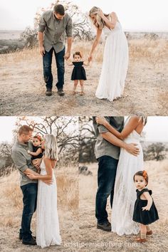 a man and woman are holding their baby in the field