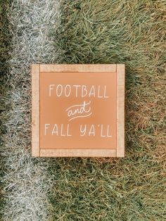 a sign that says football and not fall y'all on the ground with grass