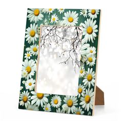 a photo frame decorated with daisies on a white background