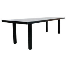 a rectangular table with black legs on a white background