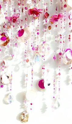 pink and white beads hanging from the ceiling