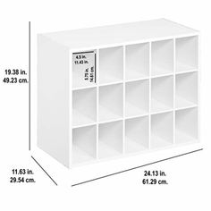 a white bookcase with compartments and measurements for the width of each shelf in front of it