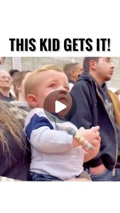 a young child is holding onto an adult's hand with the caption, this kid gets it