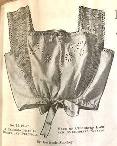 an old book with lace on it showing the back of a blouse and side ties