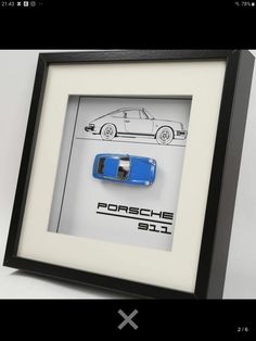 a blue car is in a black frame