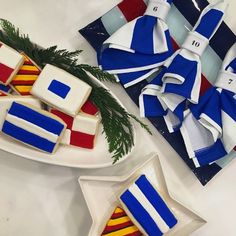 decorated cookies on plates with bows and pine branches in the center, along with other decorations