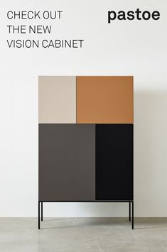 a cabinet with different colors on it in front of a white wall