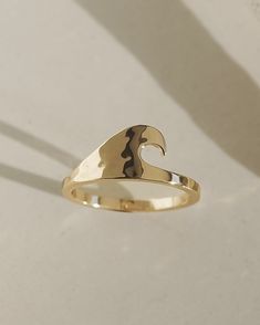 Material: 10k gold plated over brass Dimensions: 9mm (ring face) Coastal Fits, Ocean Rings, 9mm Ring, California Jewelry, Beach Rings, Surfer Jewelry, Unique Gold Rings, Gold Wave Ring, Preppy Jewelry