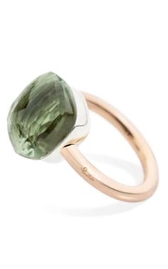 a ring with a green stone on it