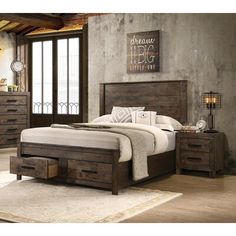 a bed sitting in a bedroom next to a wooden dresser and chest with two drawers