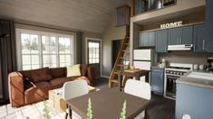 a living room and kitchen area in a house with wood floors, blue cabinets, gray walls, and wooden stairs