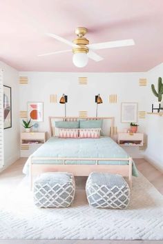 a bedroom with pink walls and white carpet