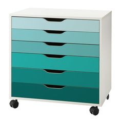 a white and blue dresser with four drawers