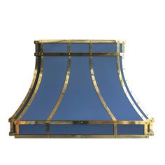 a blue and gold lamp shade on a white background