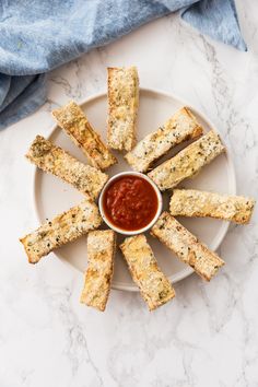 crackers on a plate with dipping sauce