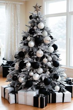 a decorated christmas tree with black and white ornaments