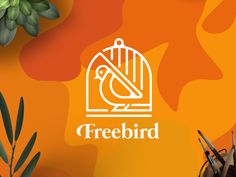 a bird in a cage with the word freebird on it next to some succulents