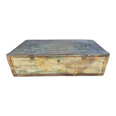 an old wooden box sitting on top of a white surface with animals painted on it