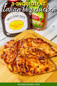 grilled chicken on a cutting board with ketchup and mustard in the background