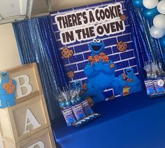 there's a cookie in the oven birthday party with blue decorations and decorating