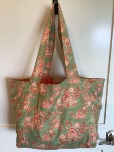 Thus extra large Coral Pagoda on a Lime Green background print tote bag is perfect for taking to market, library, beach, workout, diaper bag or multitude of uses. It is made with 100 % quilt quality fabric.  It is  is reversible with a coral print and long over the shoulder straps for easy use. I made this in my smoke/pet free studio and is ready to ship.   Also, can be used for toting your small dog around.  Would make an excellent gift.  Measurements: 24"  top width (2) 15 inch over shoulder straps  15 inch bottom length 12 inches top edge to bottom seam Green Rectangular Canvas Bag For Summer, Summer Green Rectangular Canvas Bag, Reversible Tote Beach Bag For Travel, Green Travel Pouch Beach Bag, Green Rectangular Beach Bag With Removable Pouch, Reversible Shoulder Beach Bag, Eco-friendly Reversible Beach Bags, Rectangular Green Beach Bag With Removable Pouch, Reversible Tote Vacation Bags