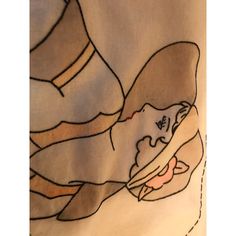 a woman's face is drawn on a piece of fabric