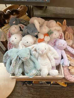 a bunch of stuffed animals sitting on top of a table