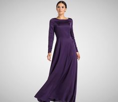 a woman in a long purple dress