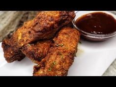 fried chicken wings with dipping sauce on the side