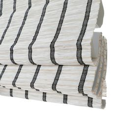 black and white striped paper rolls stacked on top of each other