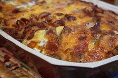 a casserole dish with bacon and cheese in it