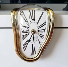 a clock that is on the side of a cabinet