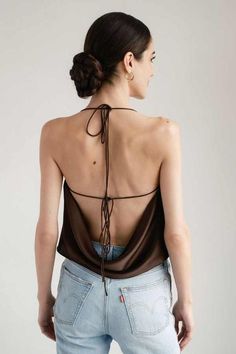 The odette silk satin draped backless top in cocoa is luxuriously draped on the bias from our signature silk charmeuse. pair it with your favorite trousers for an elevated night out look or dress it down with your favorite pair of jeans. scroll through to see the 4 different ways you can tie the straps to change up the look from delicately tied at the shoulders to almost fully backless when tied under the arms (shown in the color french rose).    care & info    - dry clean only  - 100% silk  - fully lined in silk  - bias cut    sizing notes    - true to size take your usual size.  - krysta is wearing size xs. she is 5’9” (180 cm) Emerald Dress, Skirt Ideas, Emerald Dresses, Rose Care, Summer Shades, French Rose, Draped Top, Backless Top, Strappy Top