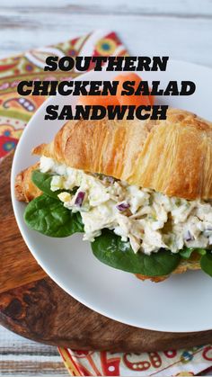 chicken salad sandwich on croissant with spinach leaves