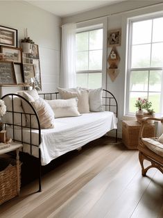 a living room filled with lots of furniture and decor on top of hard wood flooring